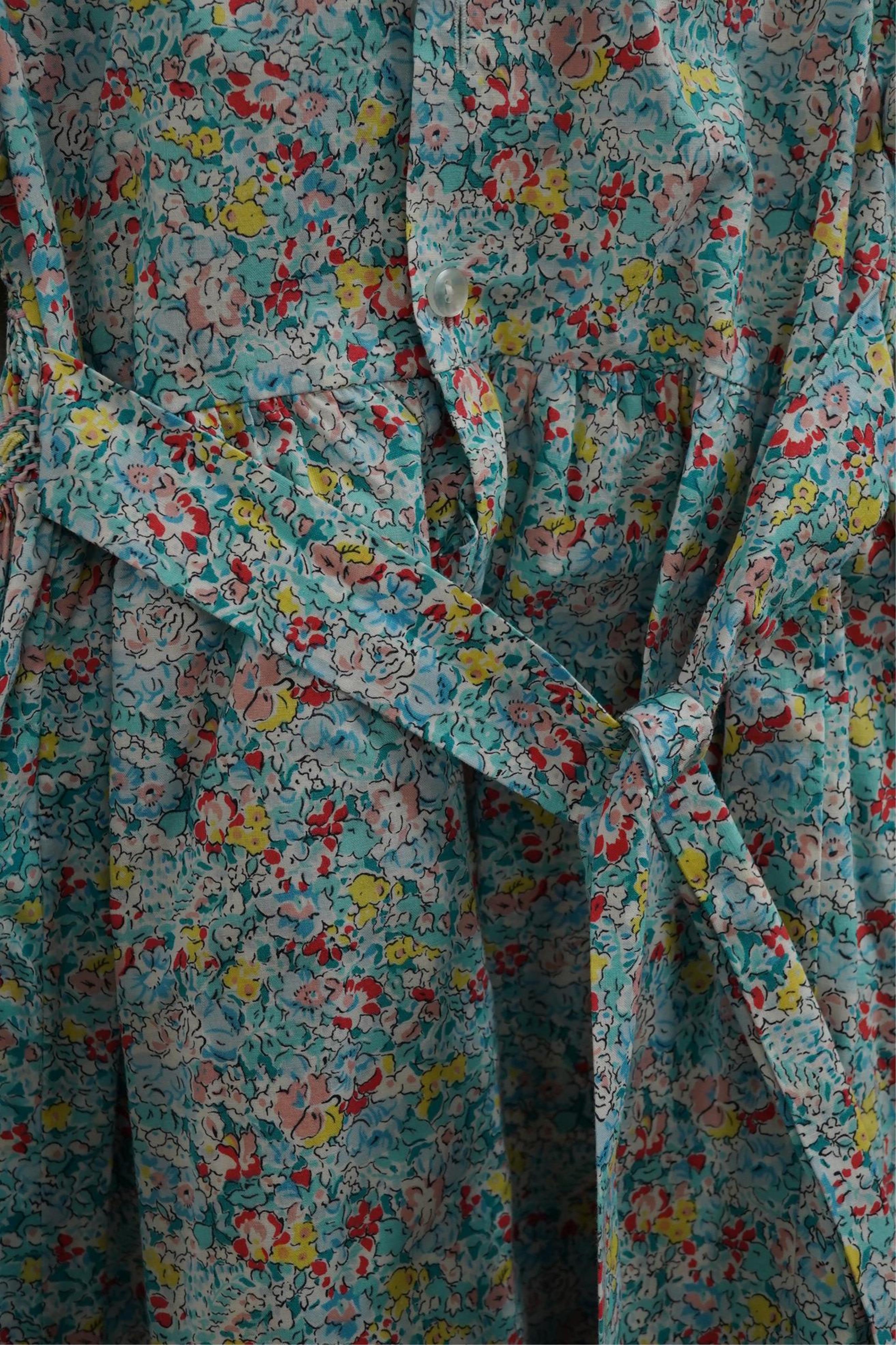 Twelve assorted 1980’s vintage children's dresses up to age eight, some hand smocked to include Harrods Belart, Chantel (including bell in hem), Michael de Leon, Heskia